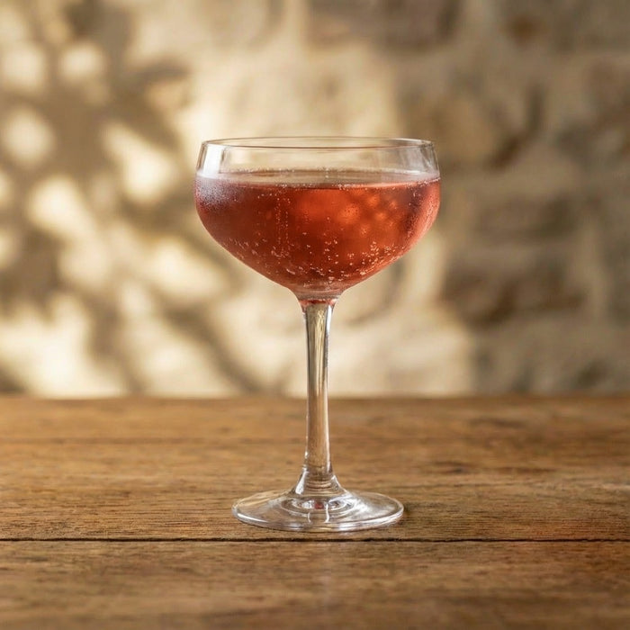 Dark cherry and prosecco fizz cocktail served over ice